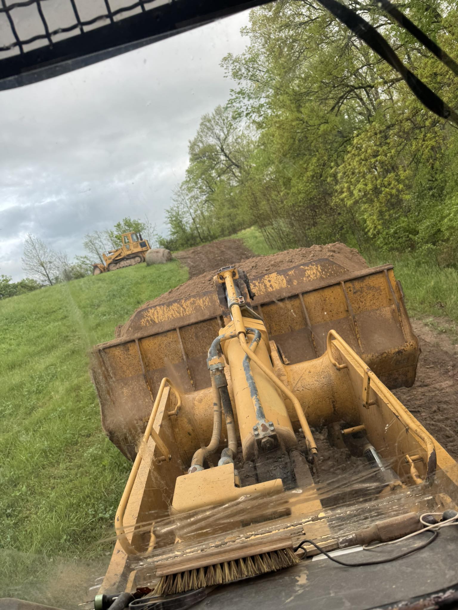 J1S earthmoving equipment working on a site